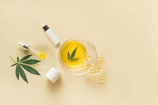 Skin care cosmetics with CBD oil and cannabis in a white mock-up package