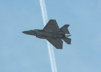 Fototapeta na wymiar Fighter jet flying at an airshow