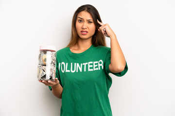 asian young woman feeling confused and puzzled, showing you are insane. donation and volunteer...