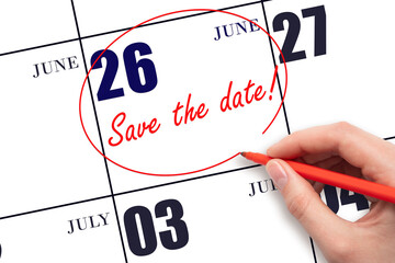 26th day of June. Hand drawing red line and writing the text Save the date on calendar date June...