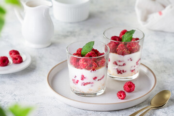 Raspberry and yogurt dessert in glasses