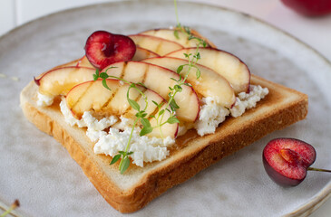 Peach and ricotta toast topped with honey
