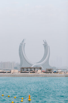 Katara Towers Against Cloudy Gray Sky