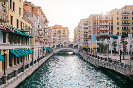 Town street with canal in morning