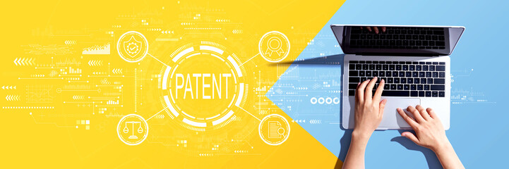 Obraz na płótnie Canvas Patent concept with person using a laptop