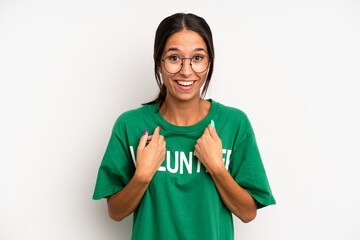 hispanic pretty woman feeling happy and pointing to self with an excited. volunteer concept
