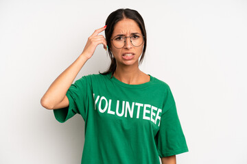 hispanic pretty woman feeling confused and puzzled, showing you are insane. volunteer concept