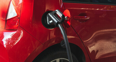 Gas pistol in red car