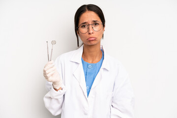 hispanic pretty woman feeling sad and whiney with an unhappy look and crying. dentist student...