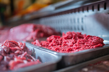 Trays with minced meat on stall