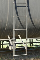 closeup of oil tanker and ladder on the tracks
