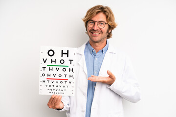 blond adult man smiling cheerfully, feeling happy and showing a concept. optical vision test concept