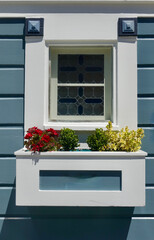vintage cottage window with stained glass and craftsman details