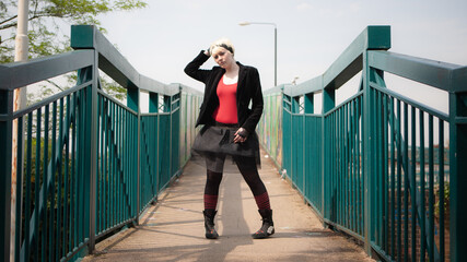 Urban Gothic. A confident portrait of an alternative lifestyle teenage female model with facial...