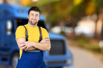 Portrait of confident truck driver on parking outdoor background