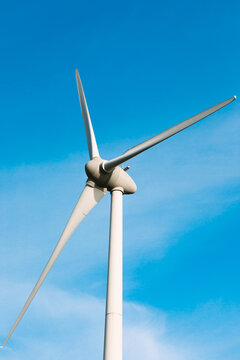 Modern windmills against blue sky