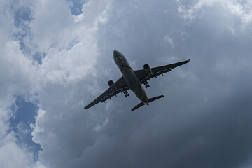 Fototapeta na wymiar Passenger airplane flying in the blue sky.