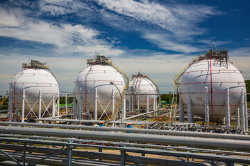 White spherical propane tanks containing fuel gas