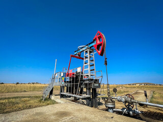 RUSSIA, TATARSTAN, AUGUST 03, 2021: An oil pump extracts oil from a well