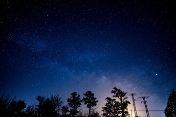 Starry sky at night in countryside