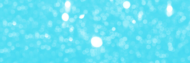 Bright blue sparkling glitter bokeh background, banner texture. Abstract defocused lights header. Wide screen wallpaper. Panoramic web banner with copy space for design