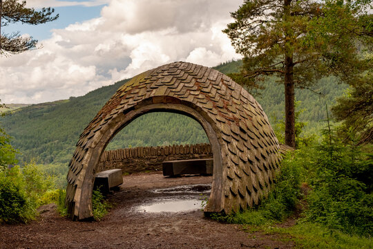 Old historic stone bridge at the entrance to Dunkeld hermitage and pine forest in Perthshire, Scotland