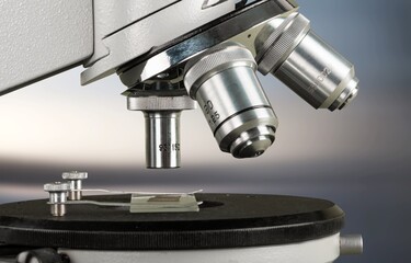 scientist prepare sample for research on microscope. Placing blood sample on microscope slide. Science and medicine concept.