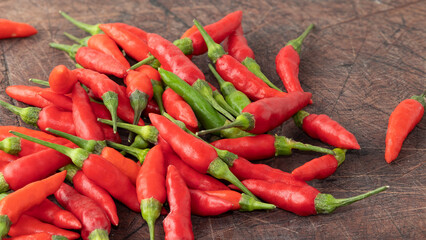 Red malagueta pepper on wooden table. Selective focus.