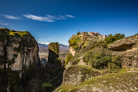 Travel scenery perspective of one of Meteora monasteries built on a tall cliff. Greece