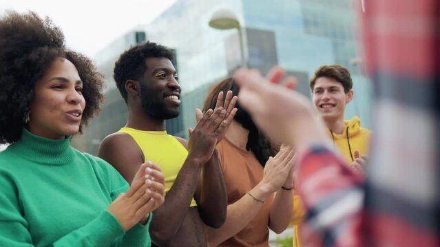 Multiethnic diverse people celebrating together outdoor - Diversity international community