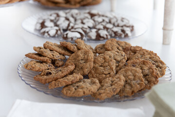 Delicious serve yourself offering of chocolate chip cookies on a plate for all the wedding guests to eat after dinner