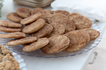 Delicious serve yourself offering of snickerdoodle cookies on a plate for all the wedding guests to eat after dinner