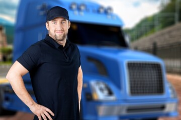 Portrait of confident truck driver on parking outdoor background