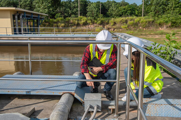 Environmental engineers work at wastewater treatment plants,Water supply engineering working at...