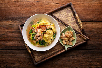 Thai food Chinese wonton soup noodle. egg noodles with pork wonton or pork dumplings  Asian food concept style. Top View