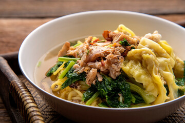 Chinese wonton soup noodle. egg noodles with pork wonton or pork dumplings  Asian food concept style. 