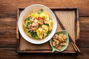 Chinese wonton soup noodle. egg noodles with pork wonton or pork dumplings  Asian food concept style. 