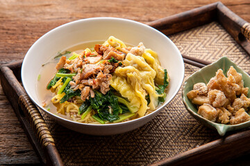 Chinese wonton soup noodle. egg noodles with pork wonton or pork dumplings  Asian food concept style. 