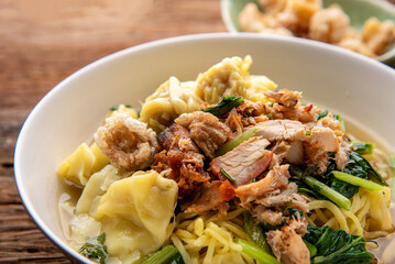 Chinese wonton soup noodle. egg noodles with pork wonton or pork dumplings  Asian food concept style. 