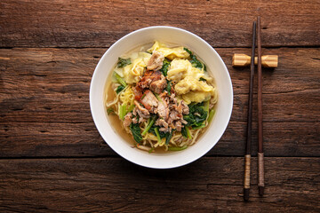 Chinese wonton soup noodle. egg noodles with pork wonton or pork dumplings  Asian food concept style. 