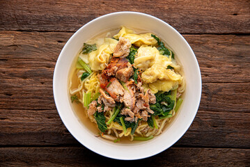 Chinese wonton soup noodle. egg noodles with pork wonton or pork dumplings  Asian food concept style. 