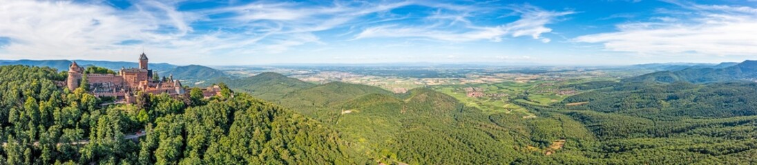 Drone panorama over Rhine plain in Alsace with historical castle during daytime
