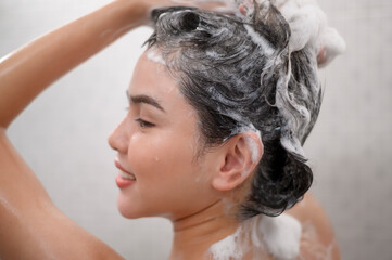 Naklejka premium Happy beautiful woman is taking a shower