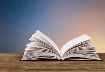 An open empty old notebook on the desk background.