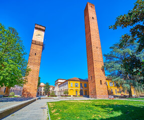 Great preserved medieval towers on Piazza Leonardo da Vinci in center Pavia, Italy