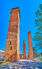 Three medieval towers on Piazza Leonardo da Vinci in Pavia, Italy