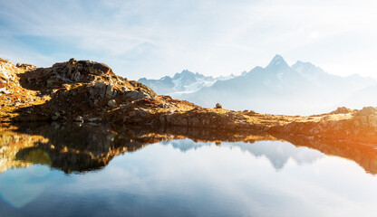 Colourful sunset on Chesery lake (Lac De Cheserys) in France Alps. Monte Bianco mountain range on...