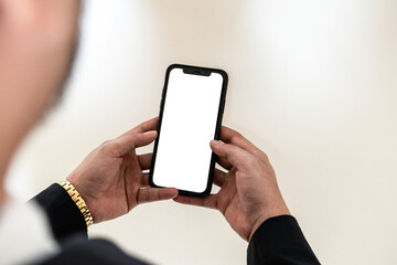 Mockup of a man browsing on to a white blank smartphone