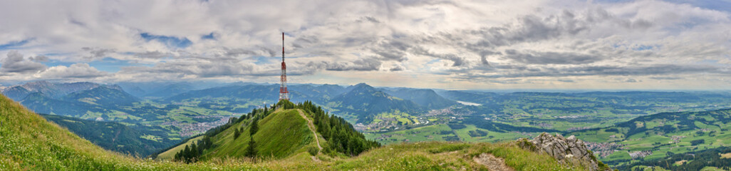 Fototapeta na wymiar panoramic landscape view from Mount Gruenten over the summits of the Allgaeu alps and Iller valley near Immenstadt, Bavaria, Germany