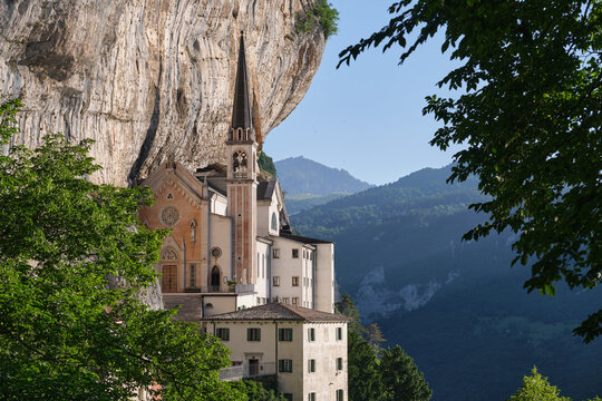 Madonna della Corona Sanctuary view, surrounded by mountains. Church in the rock, Santuario della Madonna della Corona. An old church on a quiet picturesque mountainside.
